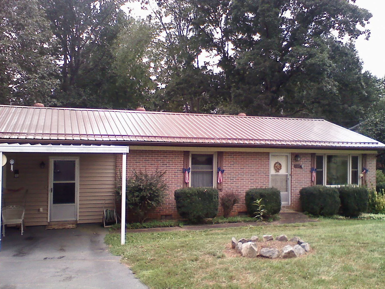 Bronze metal roof and carport on a brick ranch home in Palomar Mountain